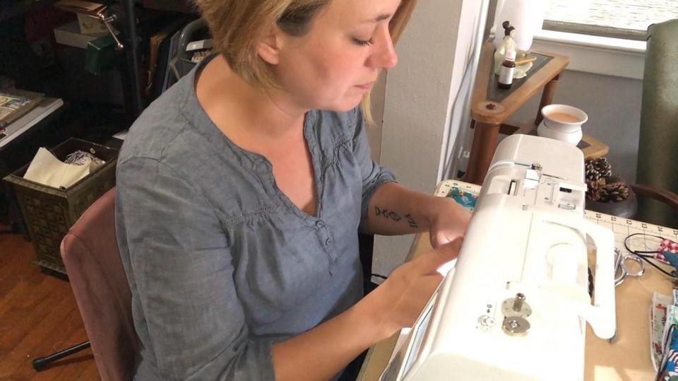 Georgia artist Jessica Pope sewing masks to help during this pandemic.