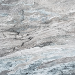 Brown Fantasy Granite - A slab of natural stone, Granite, featuring a cool, light base with a horizontally striated pattern of grey, brown, white, green and blue - Polished Finish