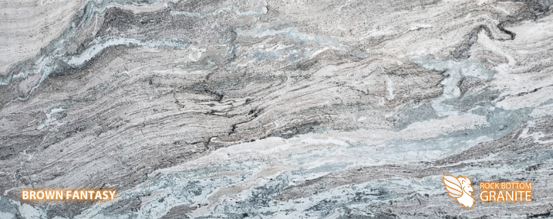 Brown Fantasy Granite - A slab of natural stone, Granite, featuring a cool, light base with a horizontally striated pattern of grey, brown, white, green and blue - Polished Finish